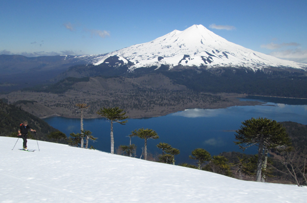 A beautiful day in October 2014, skiing along the ridge towards the peak of Sierra Nevada, with Volcan Llaima in the background.